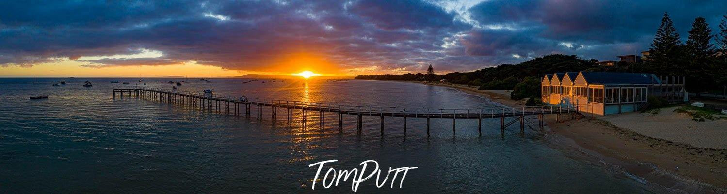 A dark long-shot of sunset behind a lake, Sunrise The Baths Sorrento - Mornington Peninsula VIC