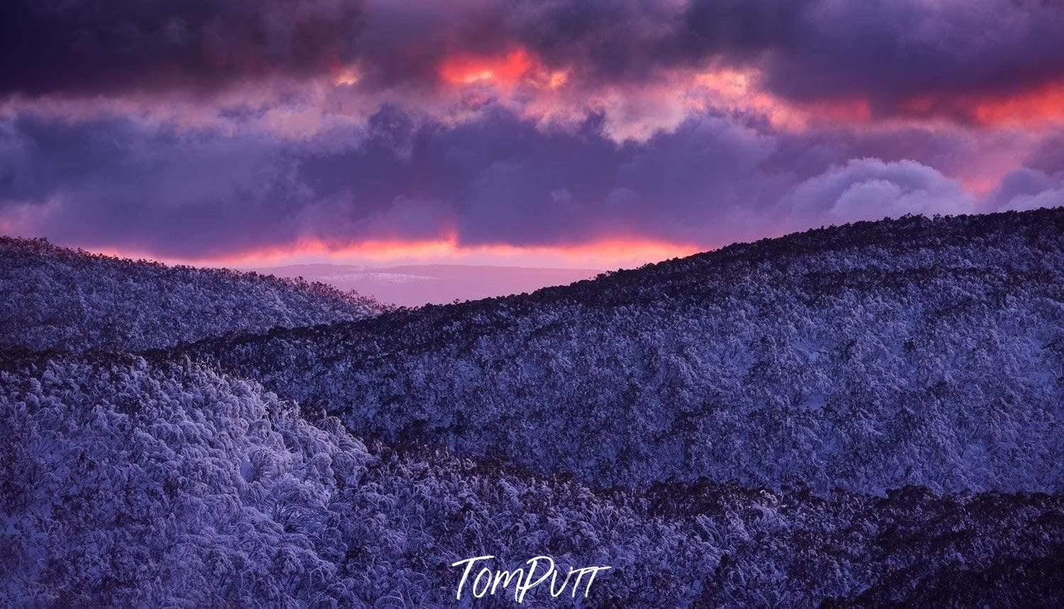 Dark glowing purple effects of clouds over a giant mountain wall, Winter Glow Sunset Mt Baw Baw VIC