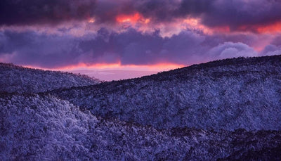 Dark glowing purple effects of clouds over a giant mountain wall, Winter Glow Sunset Mt Baw Baw VIC