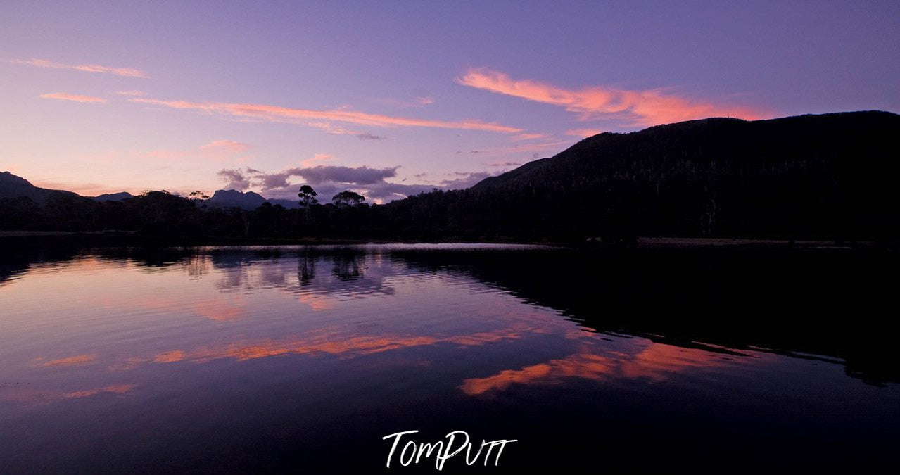 A dark view of a mountain wall with a lake below it, Cradle Mountain #19, Tasmania