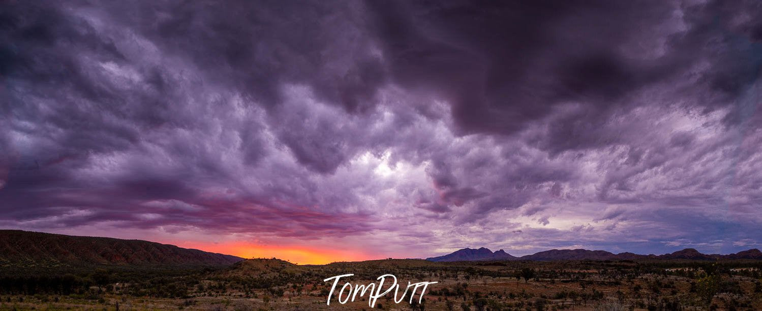 Massive dark clouds over the, Sunset over Mount Sonder, West MacDonnell Ranges - Northern Territory