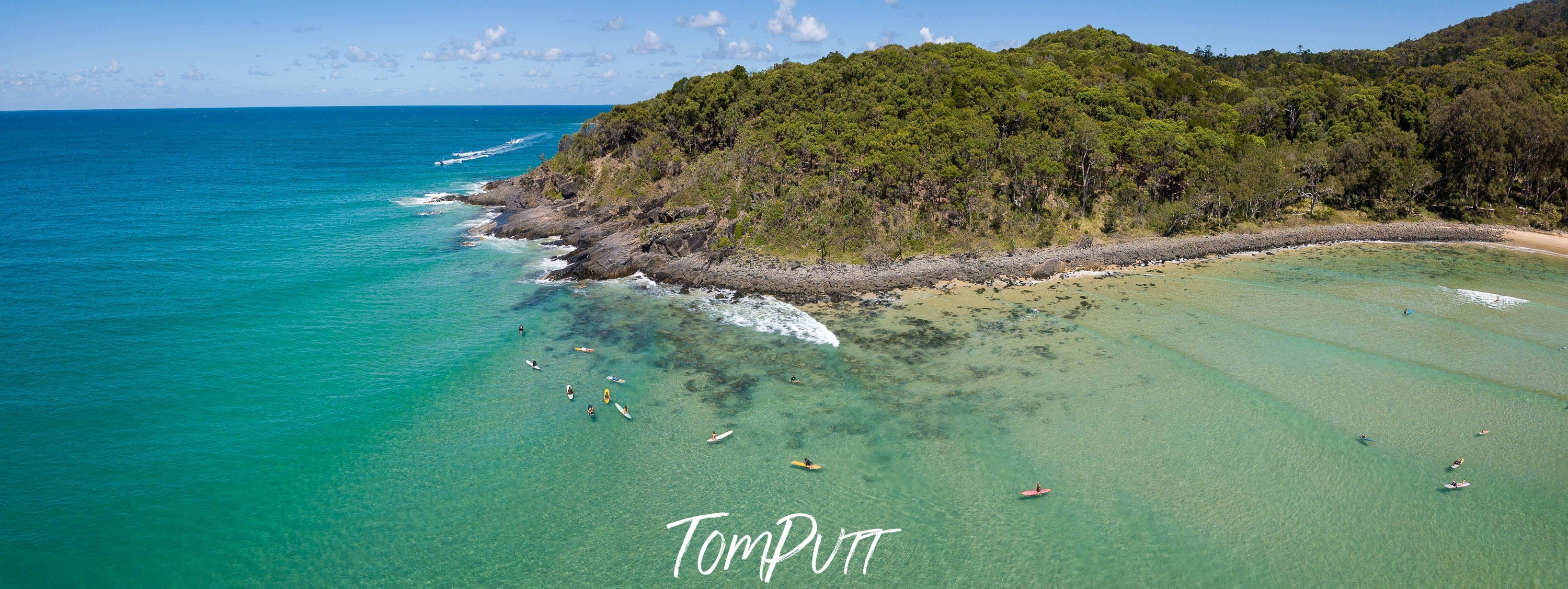 A green lake with a huge mountain wall behind, Surfers, Noosa National Park from above, Queensland