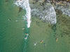 Aerial view of a lake with huge bubbling waves, Surfers catching a break, Noosa National Park, Queensland