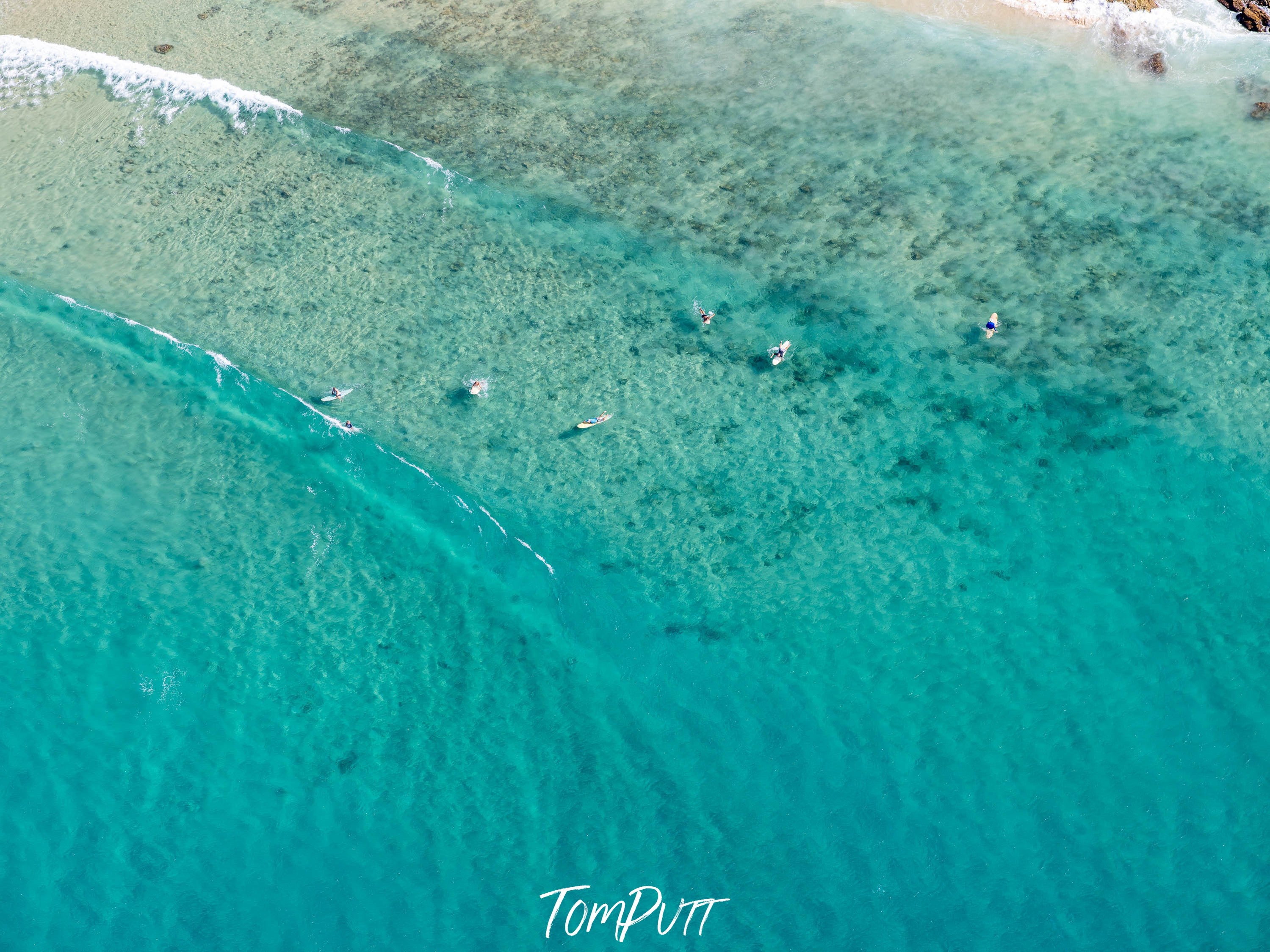 Aerial view of an ice-blue lake, Surfers from above #2, Noosa National Park, Queensland