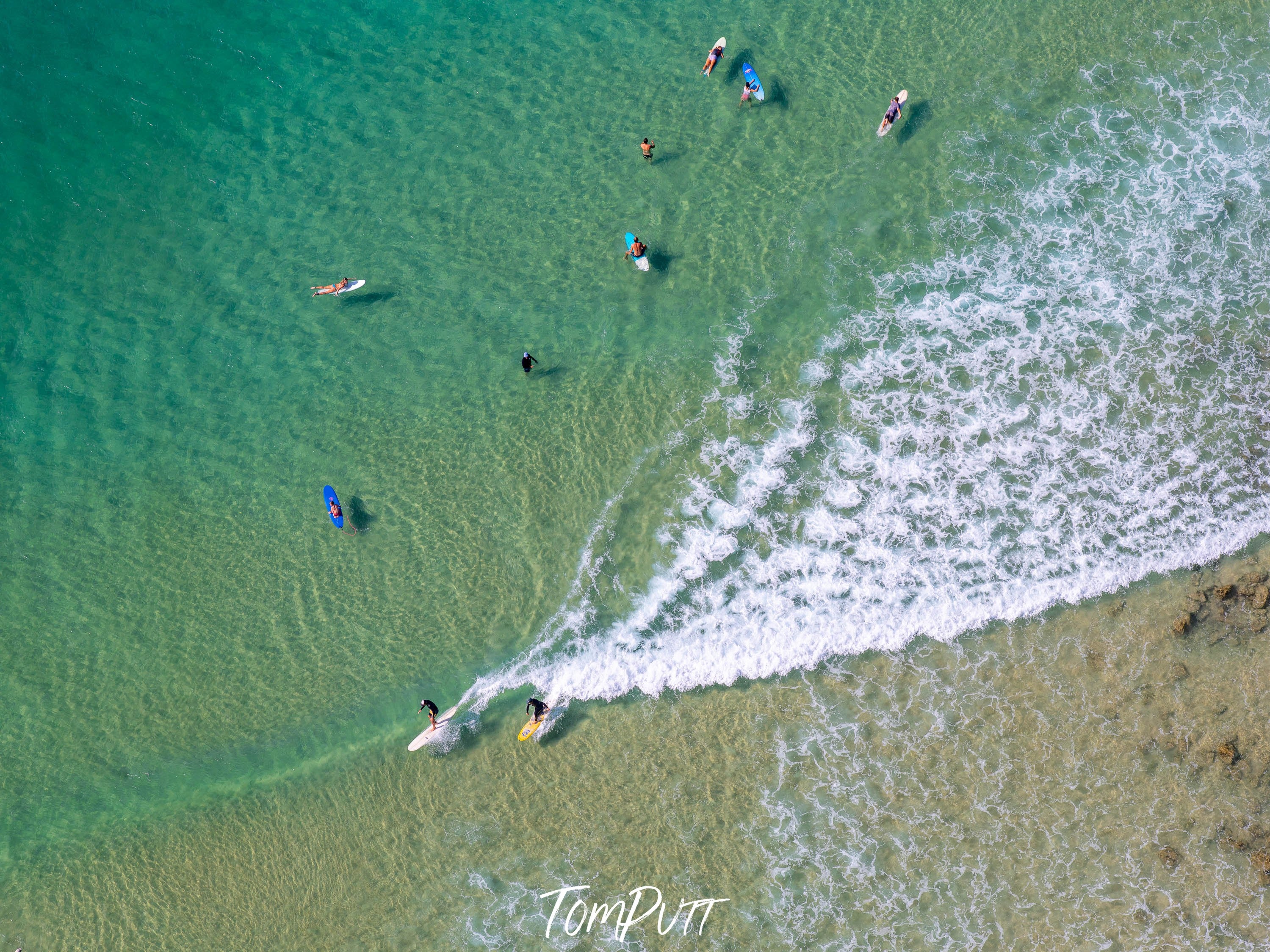 Aerial view of a seashore with giant bubbling waves on the corner, Surfers from above #3, Noosa National Park, Queensland