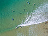Aerial view of a seashore with giant bubbling waves on the corner, Surfers from above #3, Noosa National Park, Queensland