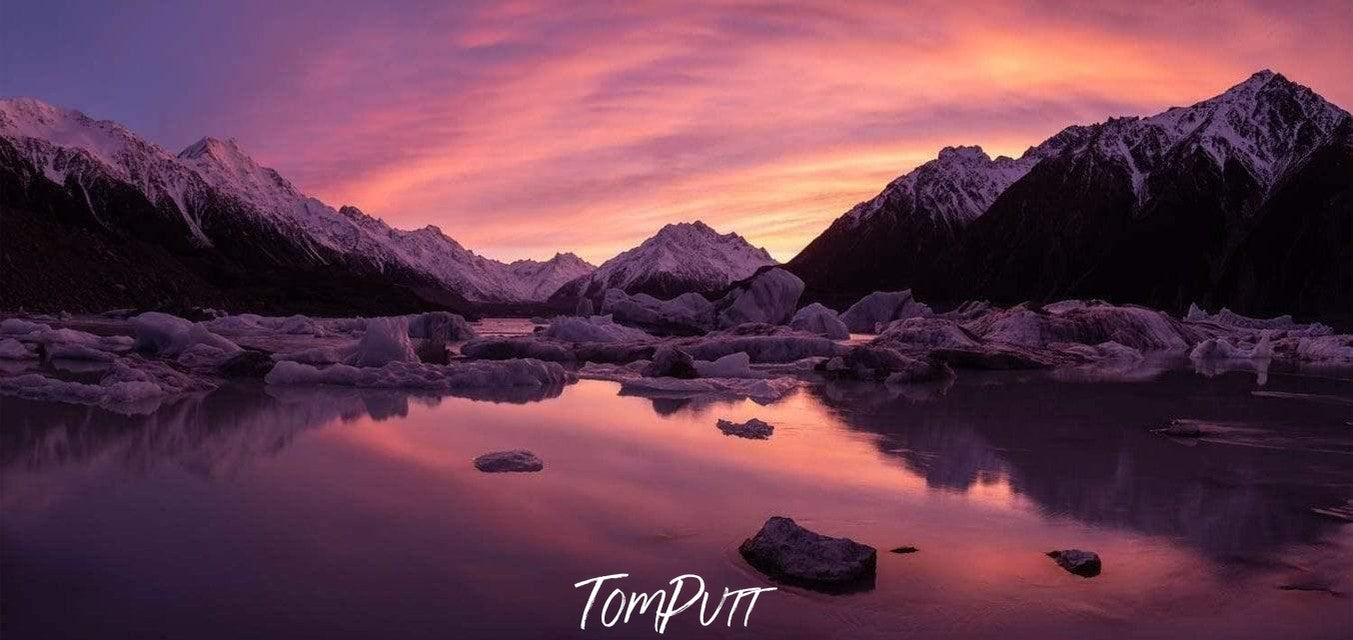 Pink scenery reflections in the lake, Tasman Glacier New Zealand