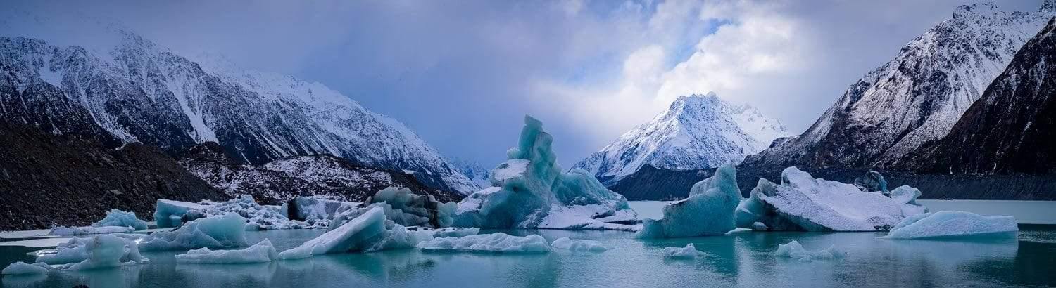 Frozen lake with some mountains, Tasman Icebergs - New Zealand