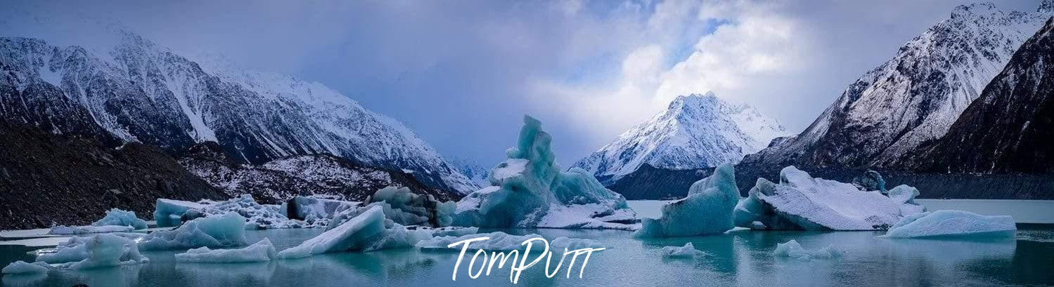 Frozen lake with some mountains, Tasman Icebergs - New Zealand