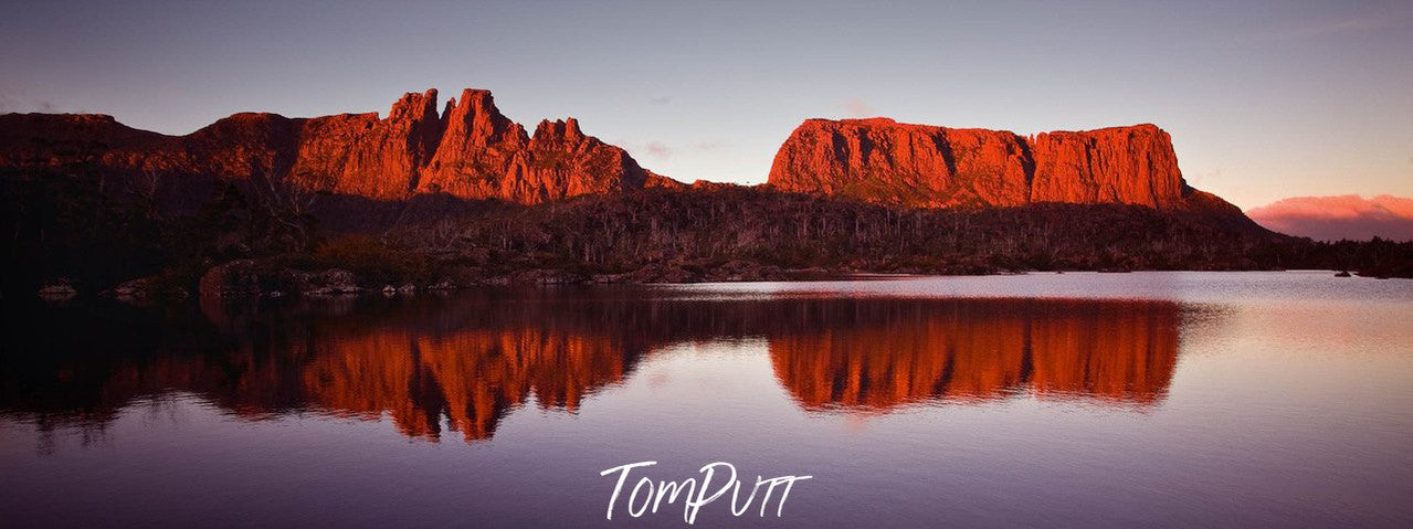 Beautiful mountain walls with sunlight on them, and a clear reflection in the water, Cradle Mountain #1, Tasmania