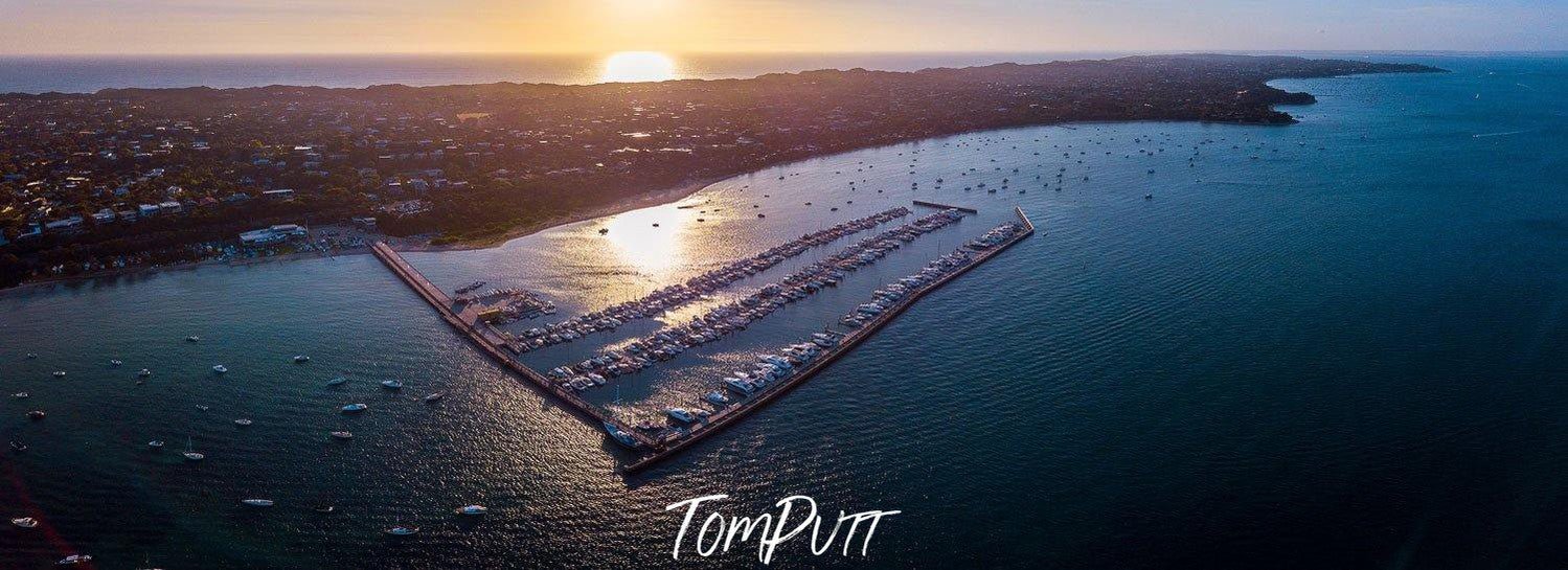 Aerial view of sunset at the sea corner with a big mountain island, The Peninsula - Mornington Peninsula VIC