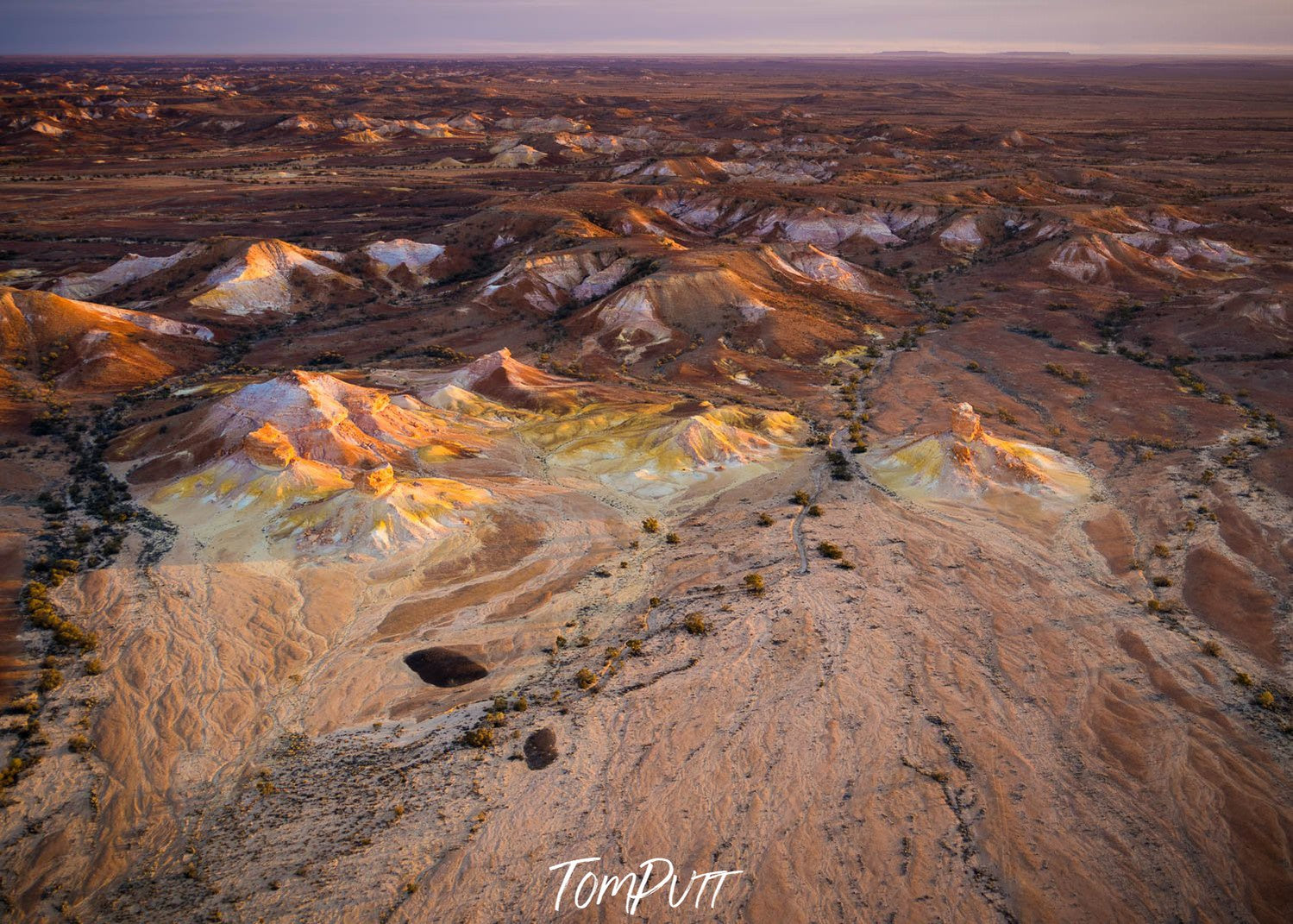 Aerial view of stony mountains with some grass on the mounds below, Painted Hills #34