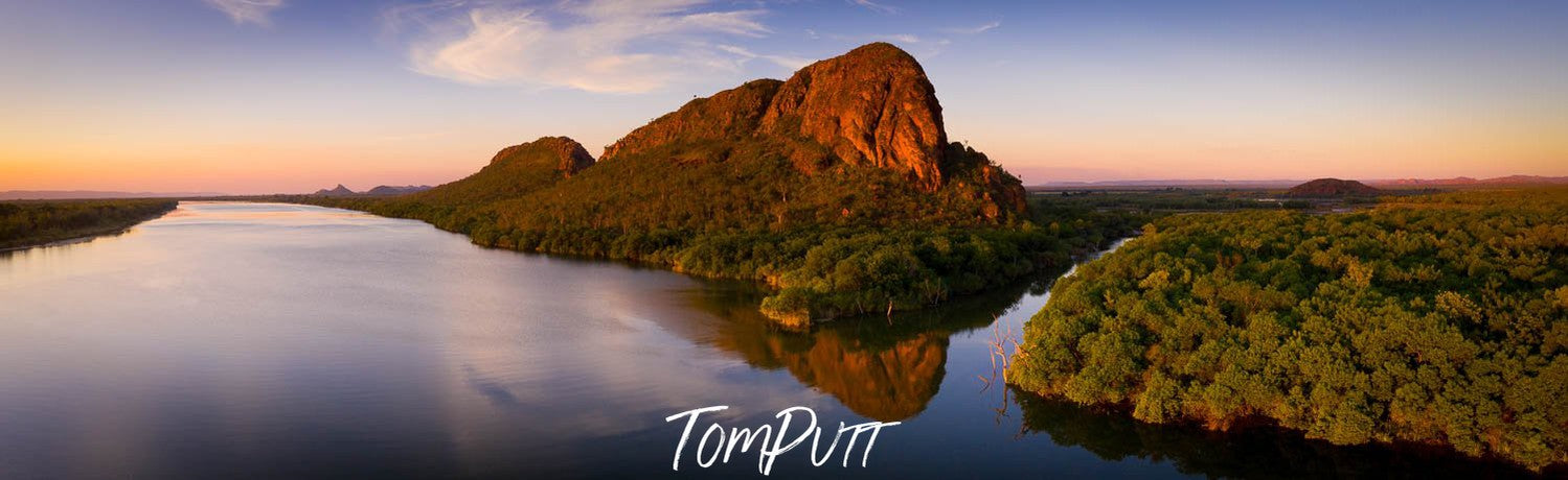 Long giant mountain walls with some greenery over standing the an ocean, The Sleeping Buddha, Carlton Ridge Kununurra