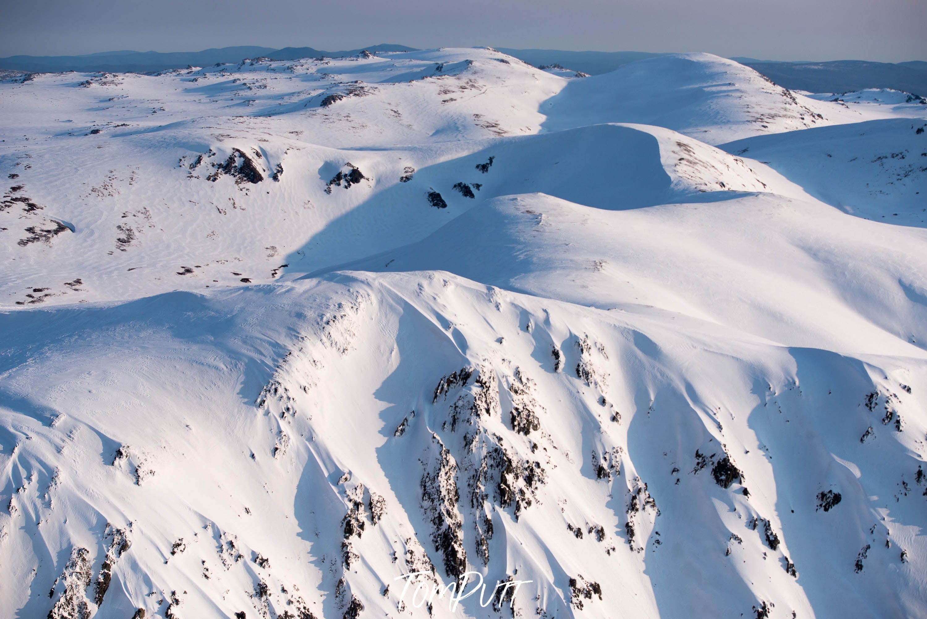 Long snowy mountain lines, The Snowy Mountains from above in winter, New South Wales