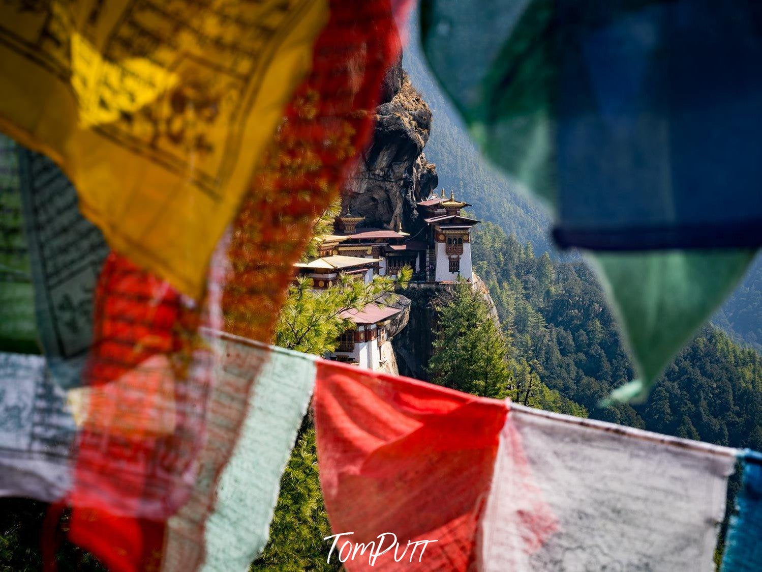 Prayers flags in a sequence and a high hill area behind, Tiger's Nest with Prayer Flags, Bhutan