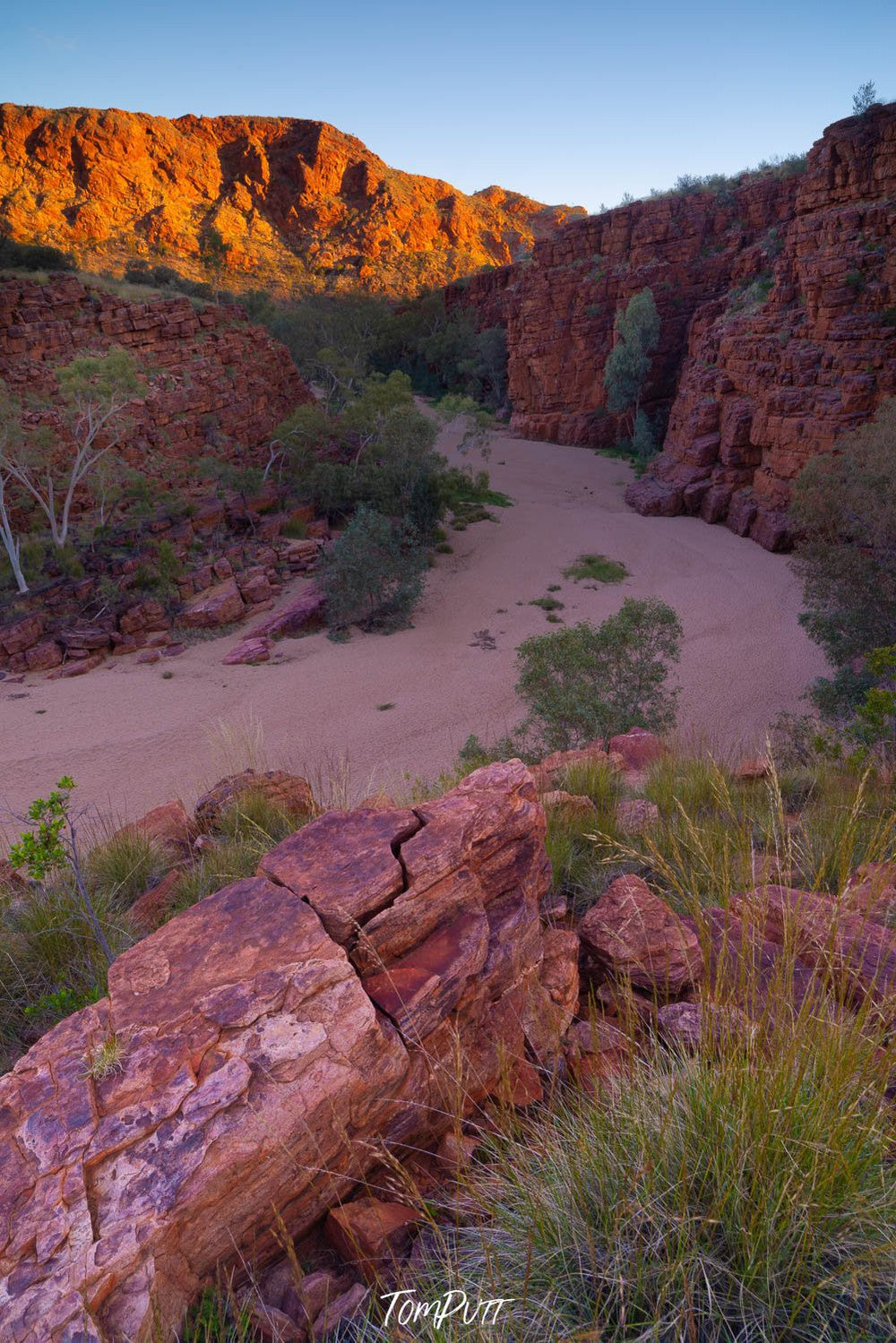 Long circular mountain walls with green bushes and plants around, Trephina Gorge - Red Centre NT