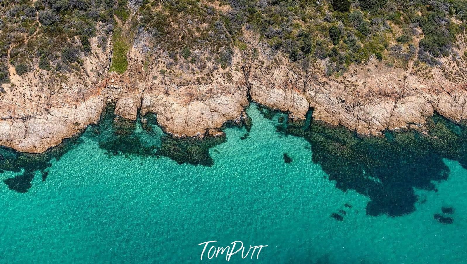 Aerial view of an ice-blue ocean with big mountain walls on the corners, Turquoise Coast, Mount Martha - Mornington Peninsula VIC