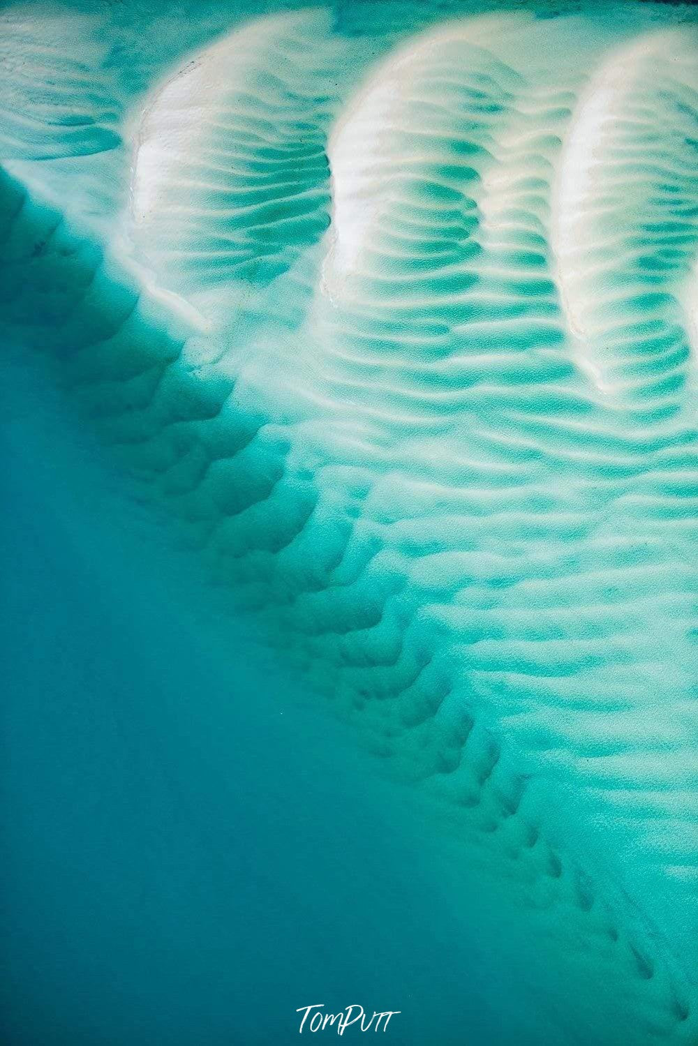 Aerial view of giant oceanic ice-blue texture with some wavy pattern, Turquoise Ripples