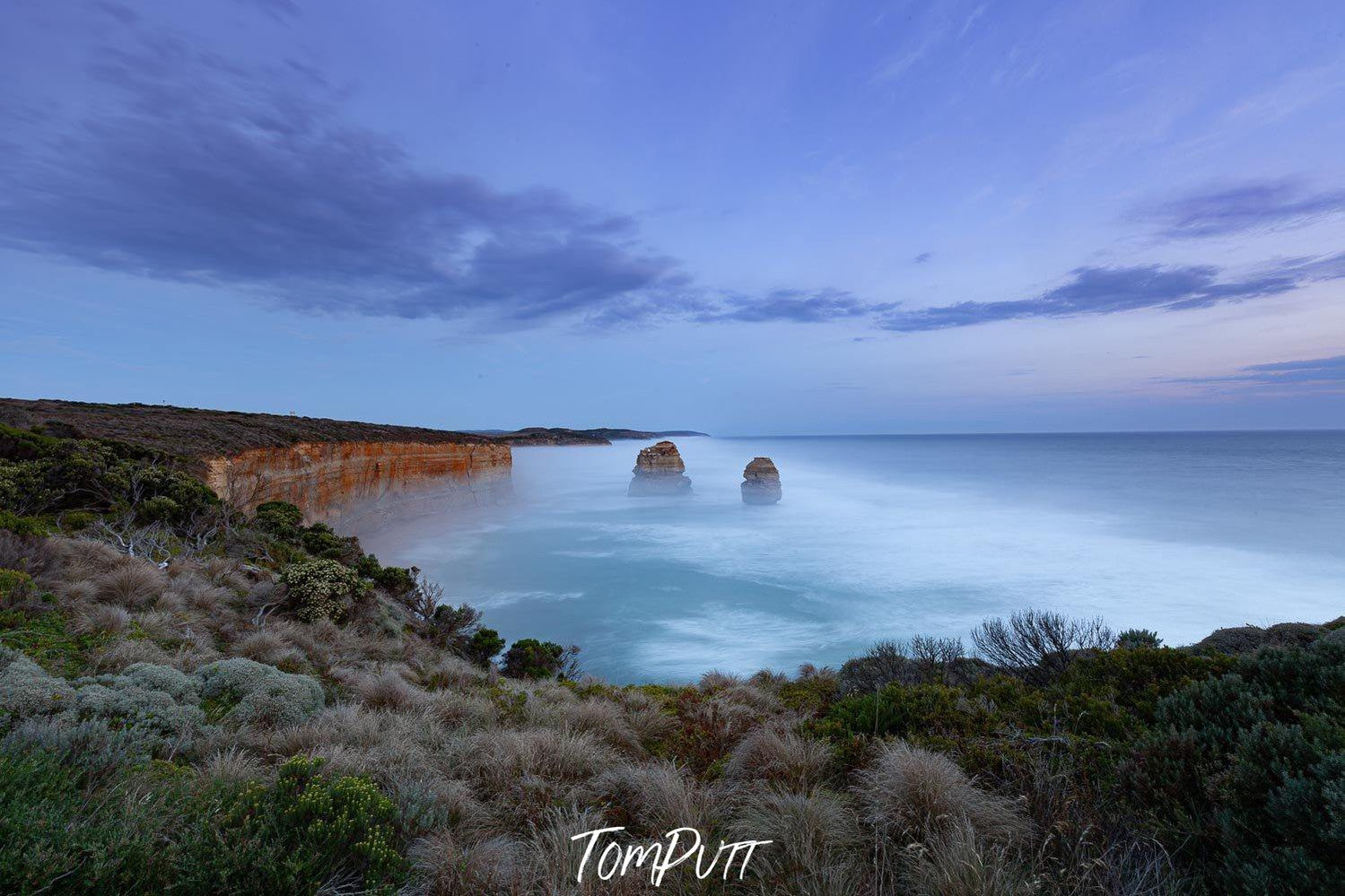 Long-shot of tow standing rocks at the sea shore, Two Apostles - Great Ocean Road VIC