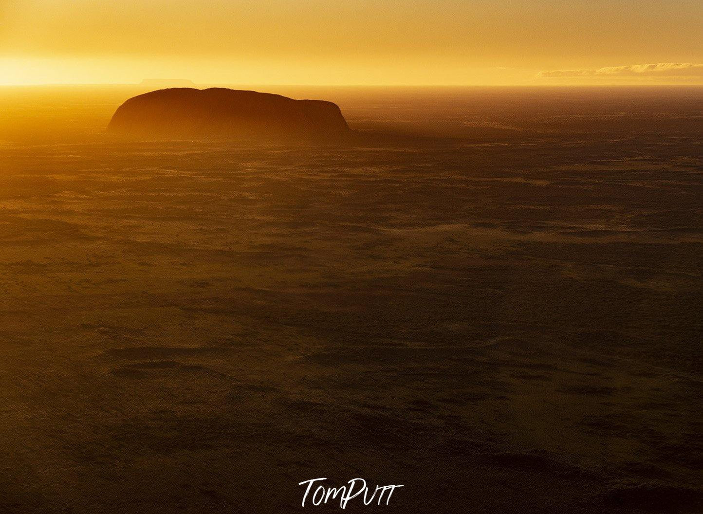 A giant golden mountain standing alone with the sunset effect, Uluru Dawn