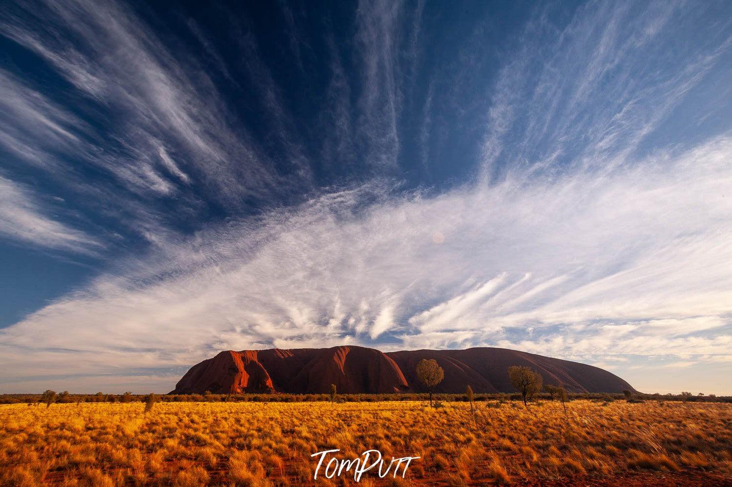 Uluru Sunrise with streaming clouds, Central Australia