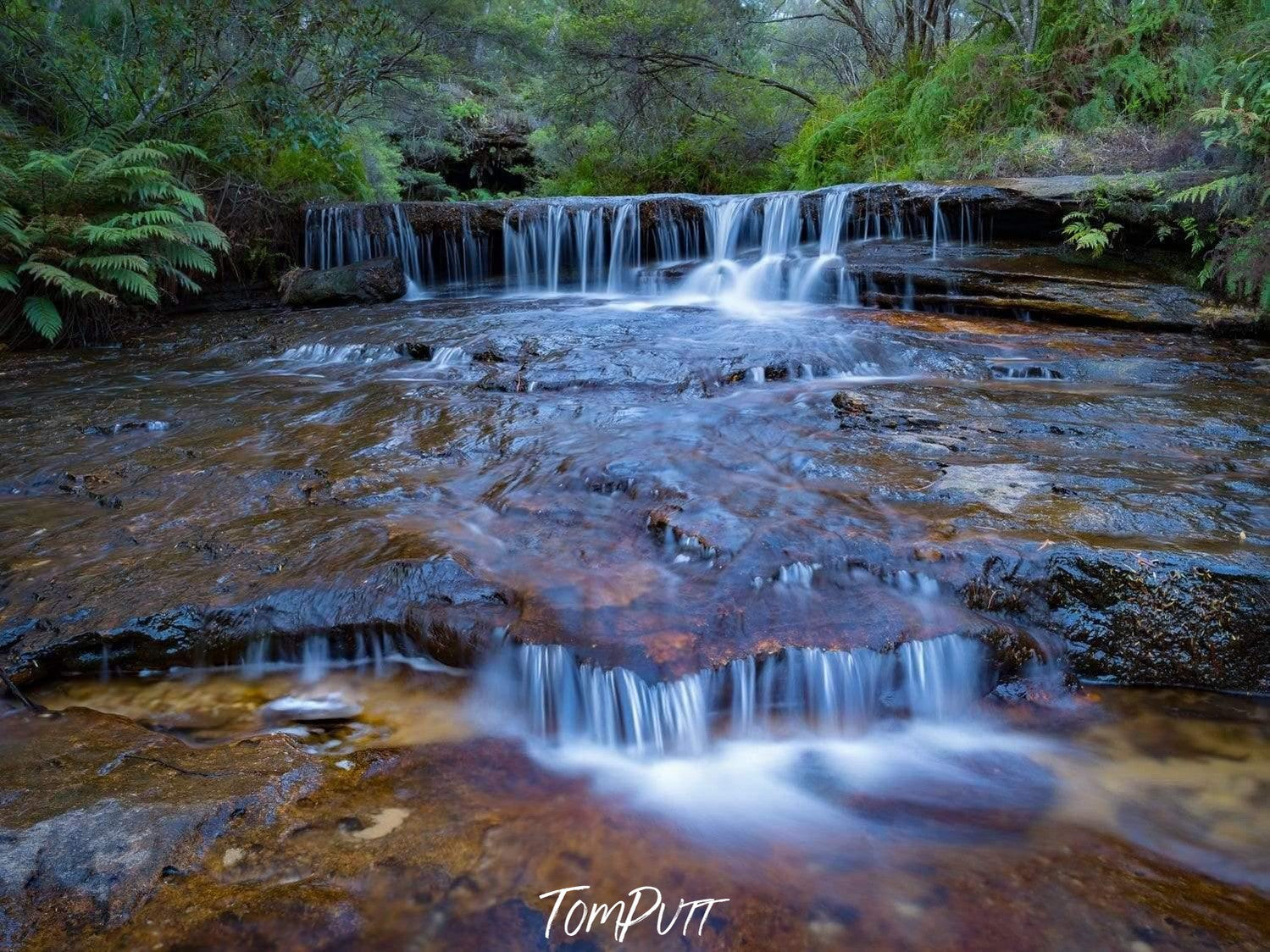 A wide nested waterfall from the above surface with a lot of bushes and grass over, Wentworth - Blue Mountains NSW 