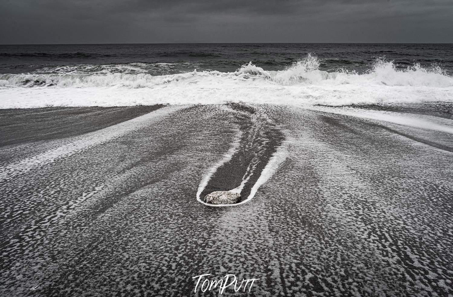 A stormy seashore with big bubbling waves of water, West Coast - New Zealand