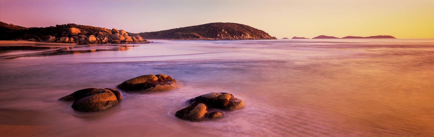 Big stones on the seashore with some massive mounds behind, Whisky Sunset - Wilson's Promontory VIC