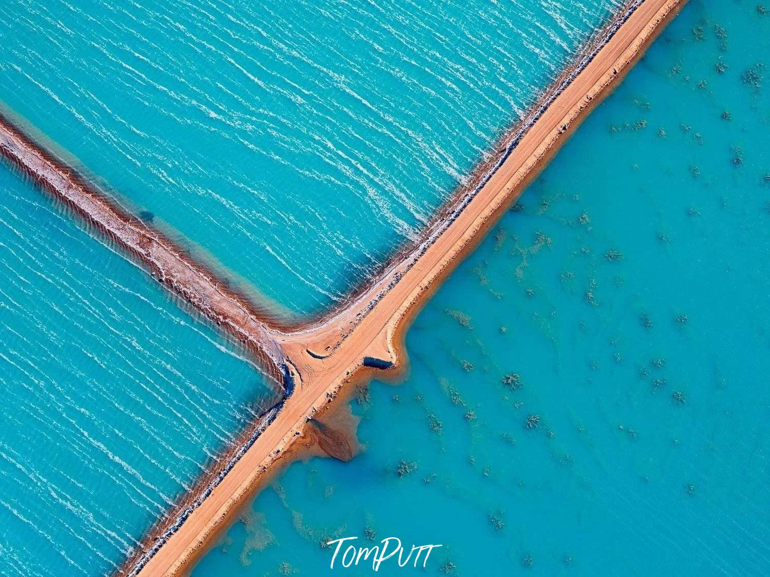 Aerial view of an ice-blue lake with separation lines in between, Wind Blown