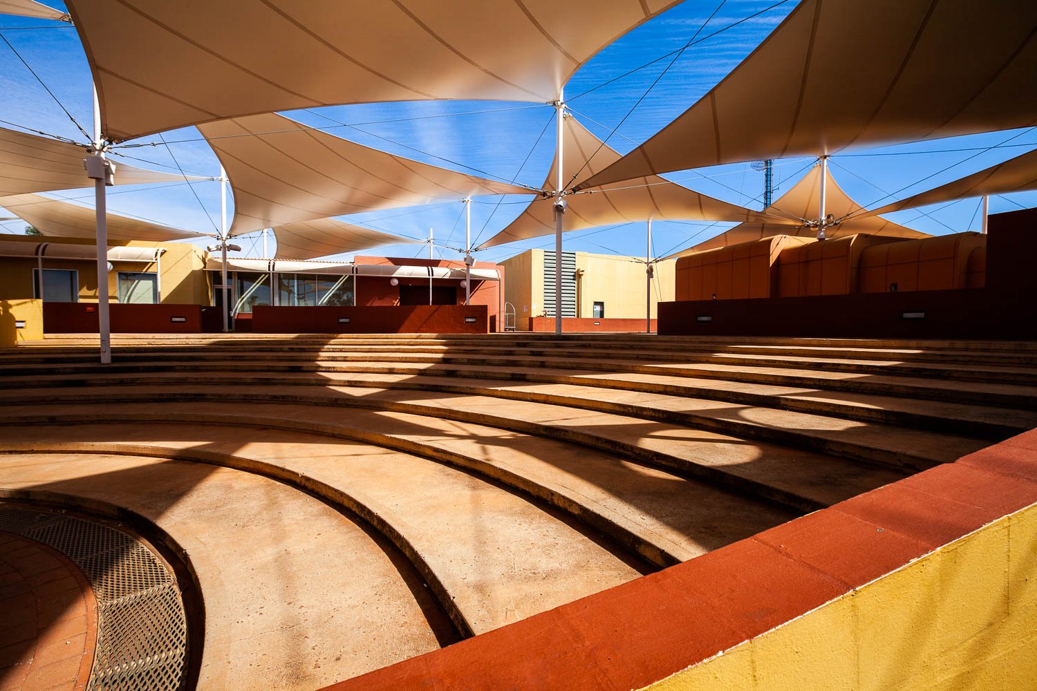 The beautiful inside architecture of a big lobby with lite rays of sunlight coming in, Yulara Resort #5 - Red Centre NT